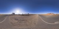 a panoramic view of a street from the bottom up, of a car