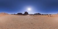 a 360 view of the landscape with mountains and rocks, some rocks are in the background and another is a desert area