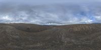 a big view of the clouds over the hill tops from within the panoramic