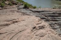 the large piece of rock that has not been cut out is a fault in the river bank