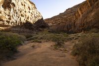 a trail leading through two large mountain sides into a canyon below it is no vegetation and no vegetation