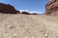 dirt and rock field with blue sky on a clear day in arizona's red rocks