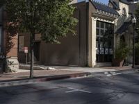 the city street has several buildings and a sign saying don't walk out of the window