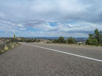 Utah Road: Asphalt, Nature, and Clouds