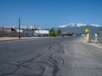 Utah Road with Clear Sky and Snowy Mountains