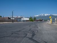 Utah Road with Clear Sky and Snowy Mountains