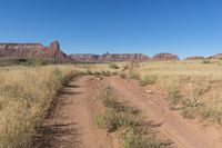 Utah Road: Dirt, Gravel, and Mountain Landscape