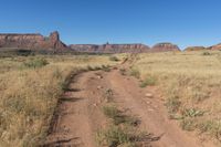 Utah Road: Dirt, Gravel, and Mountain Landscape