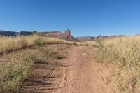 Utah Road: Dirt, Gravel, and Mountain Landscape