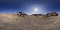 360 - view photograph of a road on the edge of a rocky cliff range at dusk