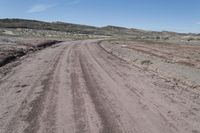 Utah Road through Rugged Landscape and Red Rock