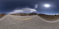 a highway with white markings is shown through two distorted images of the image, both above a very dark sky