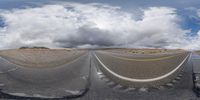 two wide angle fisheye photographs are shown here with clouds in the background and asphalt and graveled ground