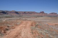 Rugged Brown Landscape in Utah, Under a Clear Sky