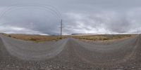 a photo taken on the side of a road near power lines and telephone lines with many circles