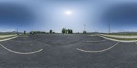 a panorama view shows the sun in the sky and a parking lot outside of a grocery center