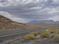 the road through the desert is deserted and deserted in all its glory as it winds into the middle east