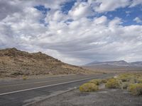 the road through the desert is deserted and deserted in all its glory as it winds into the middle east