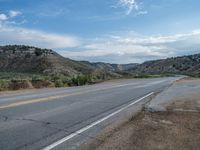 a sign saying that the road is empty of vehicles while the landscape is in the distance