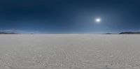 the sun shines on an open plain with snow on it in this picture,