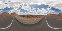 dirt roads in desert with clouds and blue sky overhead to depict climate change and weather