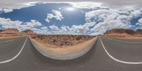 dirt roads in desert with clouds and blue sky overhead to depict climate change and weather