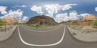 dirt roads in desert with clouds and blue sky overhead to depict climate change and weather