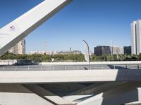 there is a large bridge with a bike next to it in the city center with tall buildings