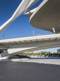 an image of the underside of the building of a building in barcelona, spain with concrete floors and arches