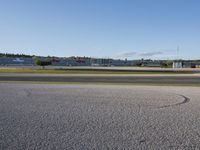 an airplane taking off from an airport runway on a clear day with blue skies overhead