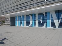 a blue and white building with a sign reading medbim on the side of it