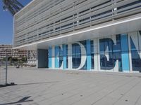 a blue and white building with a sign reading medbim on the side of it