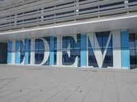 a blue and white building with a sign reading medbim on the side of it