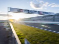 a blurry photo taken from an airplane as the sun goes down on a track