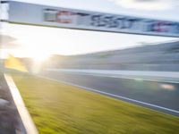 a blurry photo taken from an airplane as the sun goes down on a track