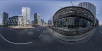 this photo is of a fish eye lens street scene in vancouver, canada taken from the corner of the street