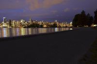 Vancouver Cityscape: Night View of Illuminated Skyscrapers