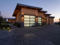 an image of a beautiful house at sunset outside the night time's lights in the door