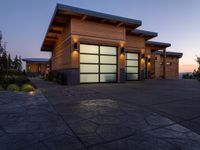 an image of a beautiful house at sunset outside the night time's lights in the door