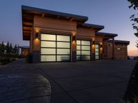 an image of a beautiful house at sunset outside the night time's lights in the door