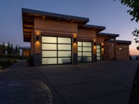 an image of a beautiful house at sunset outside the night time's lights in the door