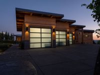 an image of a beautiful house at sunset outside the night time's lights in the door