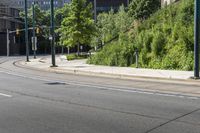 the street signs indicate an arrow in the road that is empty on the side of the road