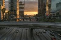 Vibrant City Skyline at Sunrise with Reflection