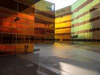 the empty area with the building reflected in it is a vibrant glow of sunlight and color