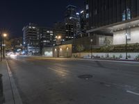 Vibrant Cityscape at Night with Lit Buildings and Street Lights