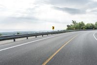 Vibrant Yellow Road With Elevated Curve