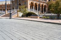 a view of the steps and sidewalks in front of an ornate building in this country town