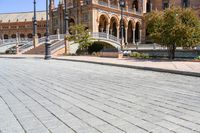 a view of the steps and sidewalks in front of an ornate building in this country town