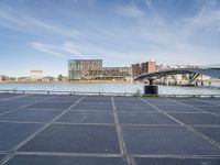 there is a large parking lot by the water and buildings at the waterfront park in downtown boston